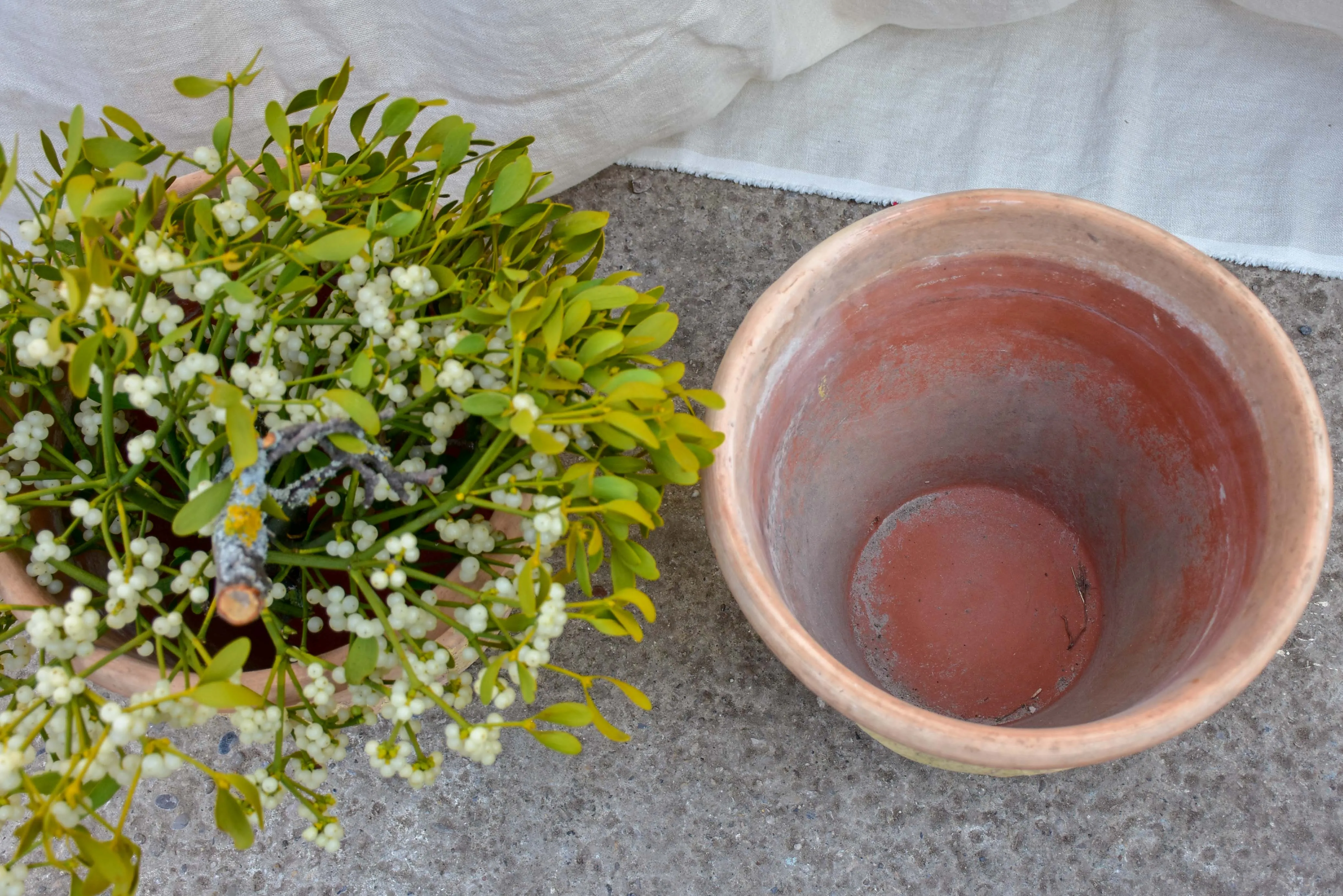 Pair of vintage terracotta garden planters with garlands