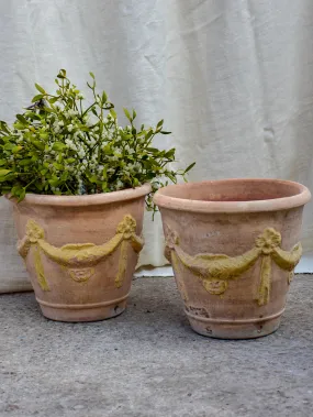 Pair of vintage terracotta garden planters with garlands